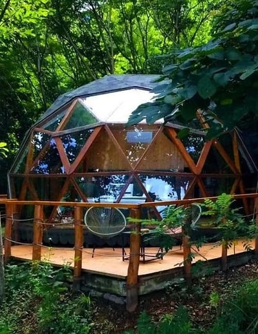 a dome shaped tenter with a patio table and chairs