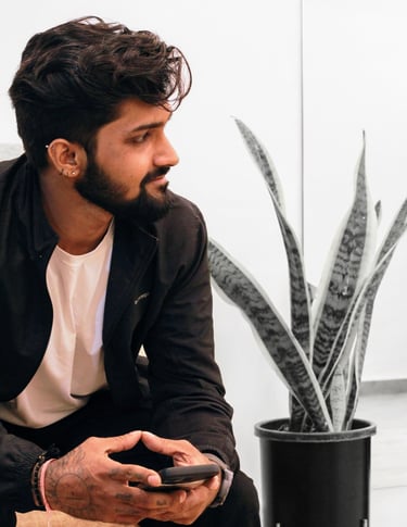 Side Profile photo of a Tattoo Artist smiling