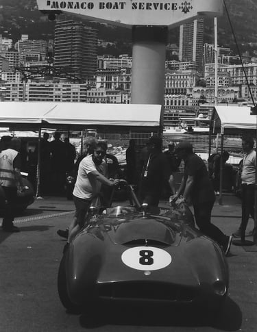 a race car parked in the paddock