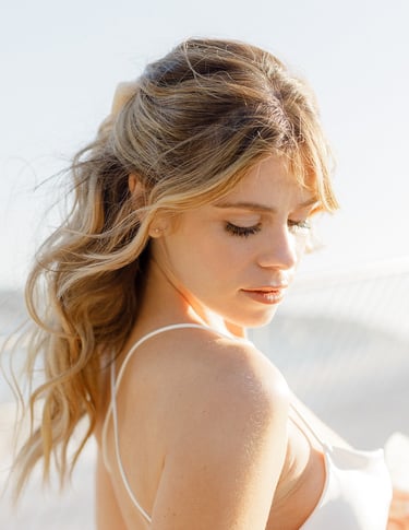 Modern Brigitte Bardot in spired bridal hairstyle