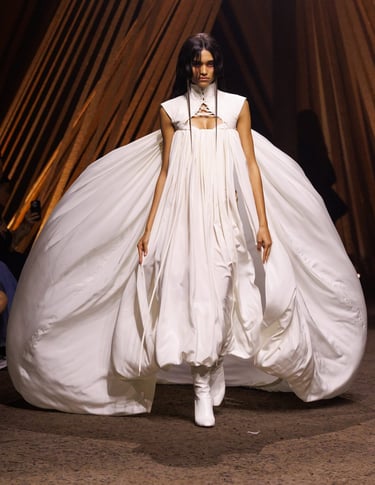 Alexander McQueen Spring Summer 2026 – Voluminous white gown with sculptural silhouette.