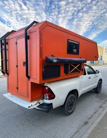 pick-up truck red camper