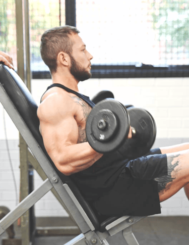 Jackson Demonstrating form and focus on a dumbell curl