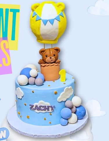 a cake with a bear and a balloon