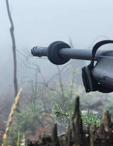 Image of a Limbsaver deresonator on a barrel over looking foggy valley.