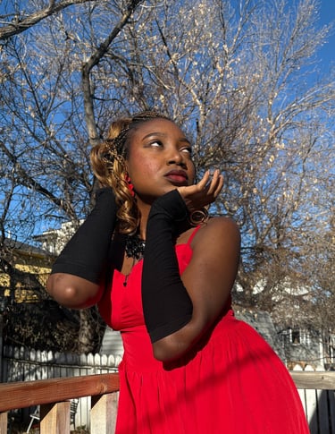 Iheoma Uzomba Oma is Loud stylish fashion pose in red gown and black sleeves