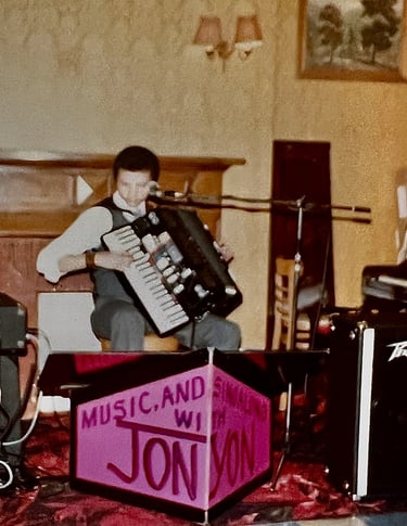 Jon Yon playing electronic accordion at one of his earlier professional gigs