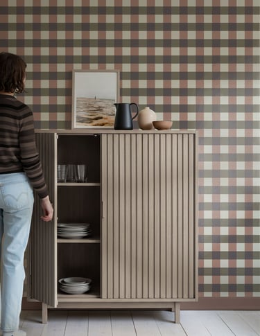 Earthy multicolor plaid wallpaper with a rustic check pattern, styled with natural wood furniture