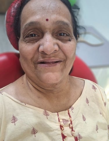  Happy dental patient smiling comfortably on dental chair at Shree Dental Care in Shyamal, Ahmedabad