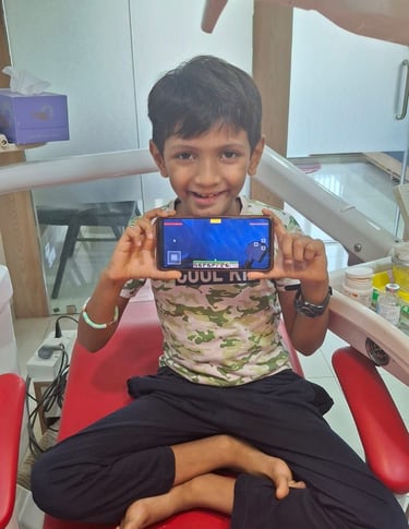 Relaxed patient sitting on dental chair during clinic visit at Shree Dental Care, Shyamal Ahmedabad