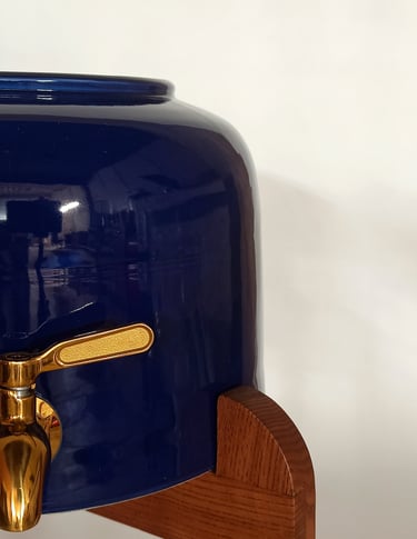 Happy customer reviewing a high-quality handcrafted ceramic water dispenser with elegant design and excellent communication.