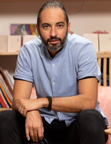 a man sitting on a couch in a room