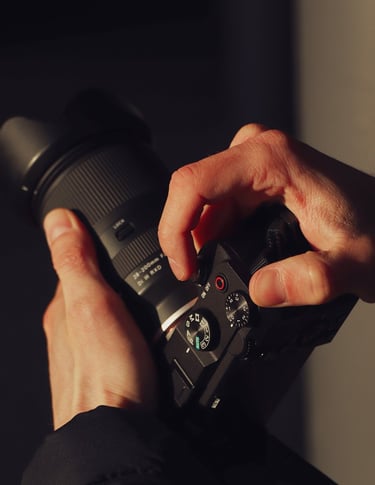 a person holding a camera and taking a picture