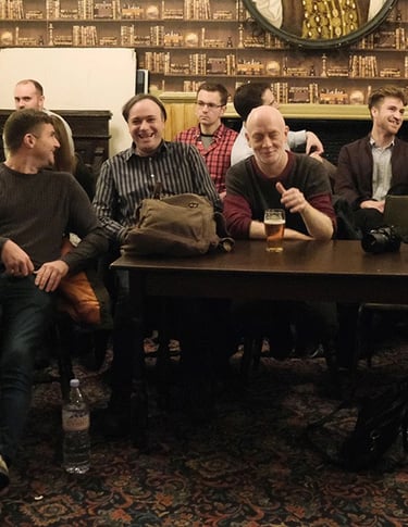 Members chat during the interval of a London Comedy Writers meeting