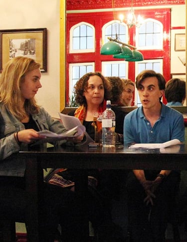 Actors performing a sitcom table read at a London Comedy Writers meeting