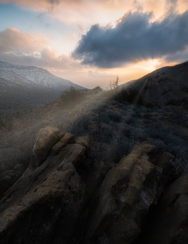 a person standing on a rocky mountain top