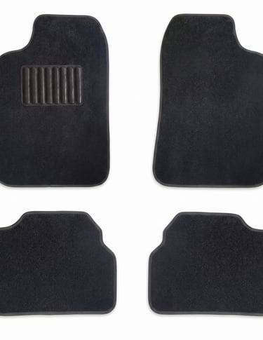 Set of four black carpet car floor mats with a protective heel pad on the driver's side mat.