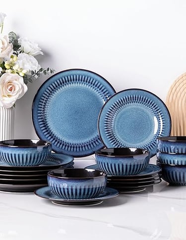 Blue stoneware dinner set with textured detailing, coastal-inspired plates and bowls.