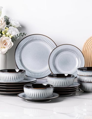 White stoneware dinner set with vertical ribbed texture, modern minimalist crockery.