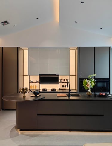 Dark modern kitchen cabinetry with layered ash-toned finish and integrated lighting.