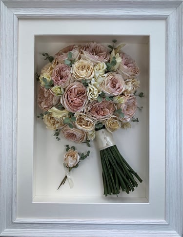 a stunning round domed side view preserved wedding bouquet in a frame