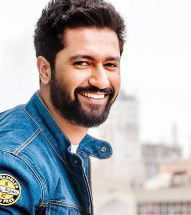 a man with a beard and a beard, smiling