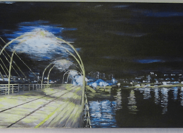 Panoramic view of Southport's Marine Lake at night looking down the historic Pier to the seafront..