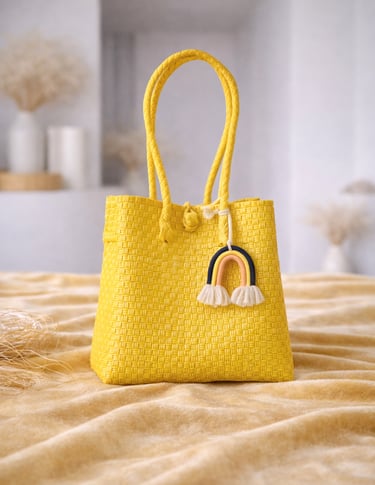 Handwoven yellow plastic tote bag handmade from recycled materials by Indonesian artisans