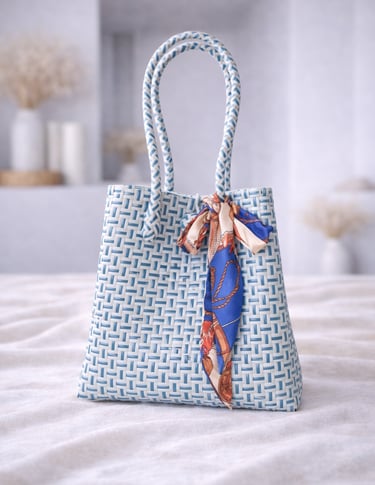 Handwoven white and blue plastic tote bag handmade from recycled materials by Indonesian artisans
