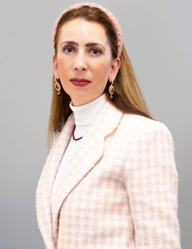a woman in a pink jacket and pink hairband