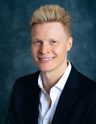 a man in a suit and white shirt