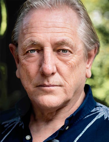 a man with a blue shirt and a black shirt. Mark Wingett