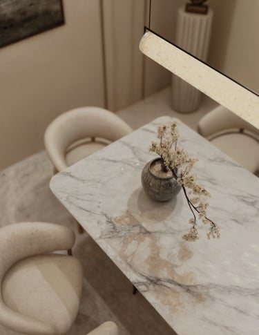 High end marble dining table with pendant lighting in Dubai luxury apartment