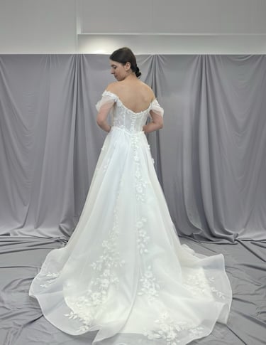 a woman in a wedding dress with a white dress