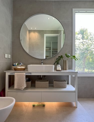 a bathroom with a large mirror and a sink