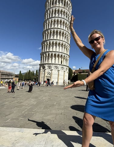Me wearing a UPF dress in Cathedral Square by the Leaning Tower in Assisi