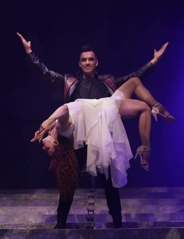 magician and assistant performing a levitation trick in a show