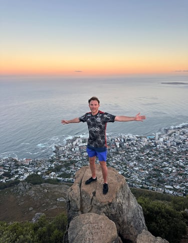 Guests at the top of Lions Head at sunrise