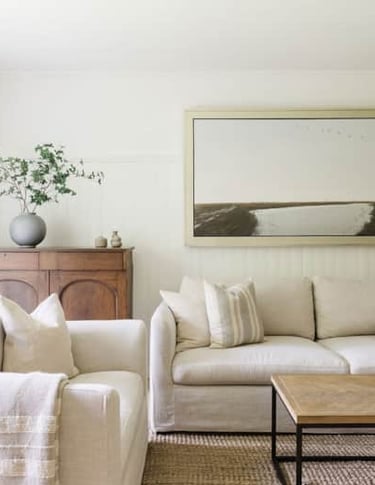 a living room with a couch and a table