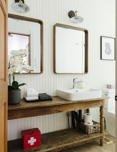 a bathroom with a sink and a vintage wooden vanity