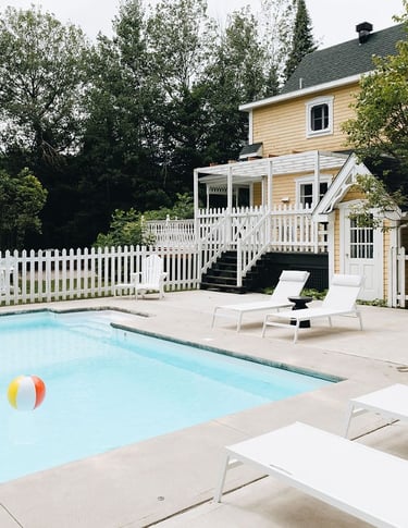 a pool with a beach ball in the middle of the pool