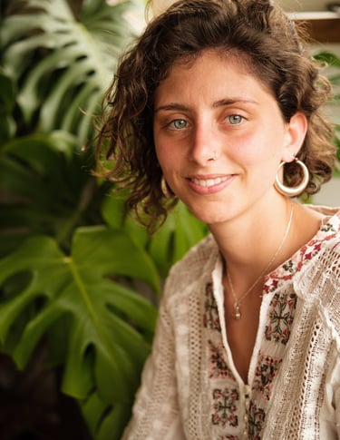 a woman with a large earring 