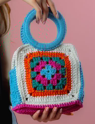 Artisanal square crochet handbag, featuring bright multicolor design by Fishberry