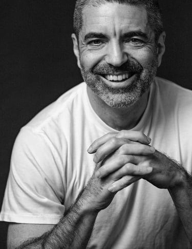a man with a beard and a white shirt