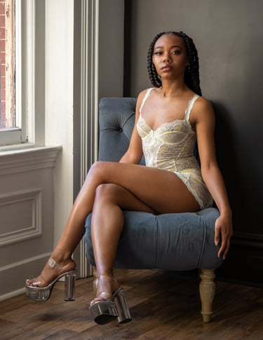 a woman in white lace bodysuit and high heels