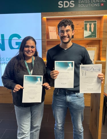 a man and woman holding up their certificates