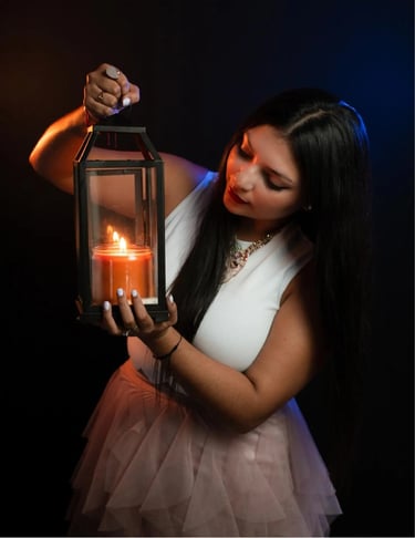 a woman holding a candle in a lantern light