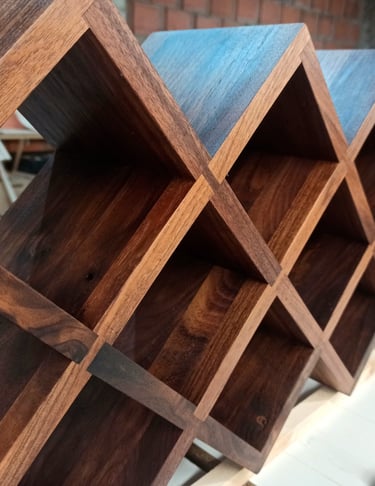 Custom wooden wine rack perfectly fitting inside a stylish living room cabinet, showcasing expert craftsmanship.