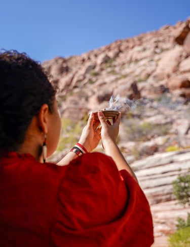 Iveth in a red jacket is holding an incense plate