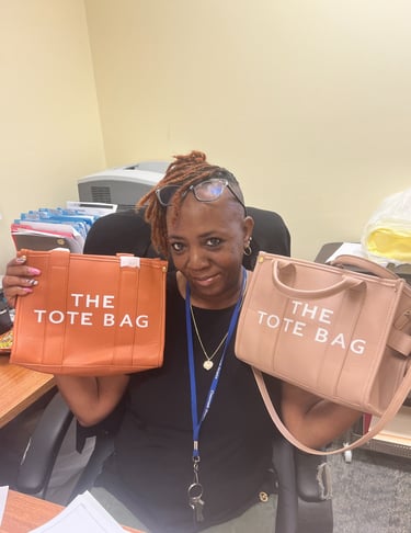 A woman holding up two designer-style tote bags in orange and tan colors.